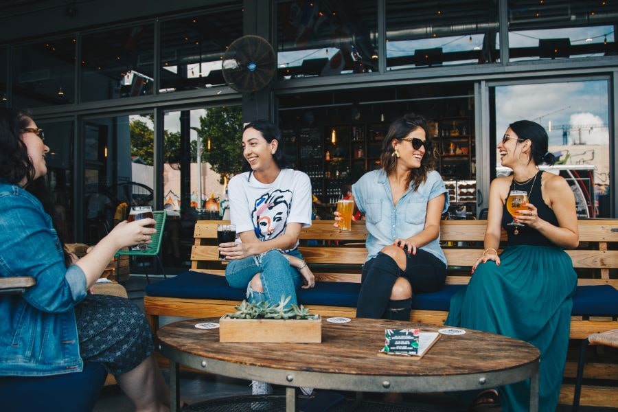 women drinking and talking