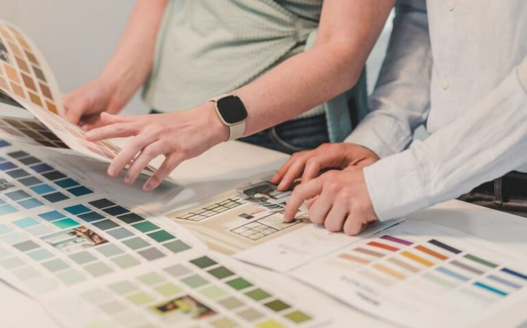 People Choosing Color of Paint in a Brochure