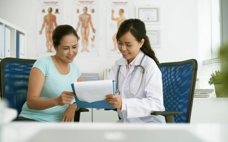 Doctor showing results to patient