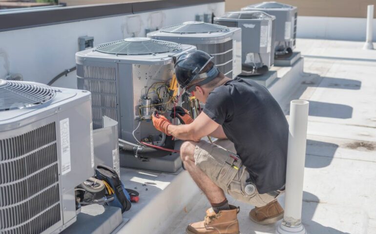 hvac tech checking a unit