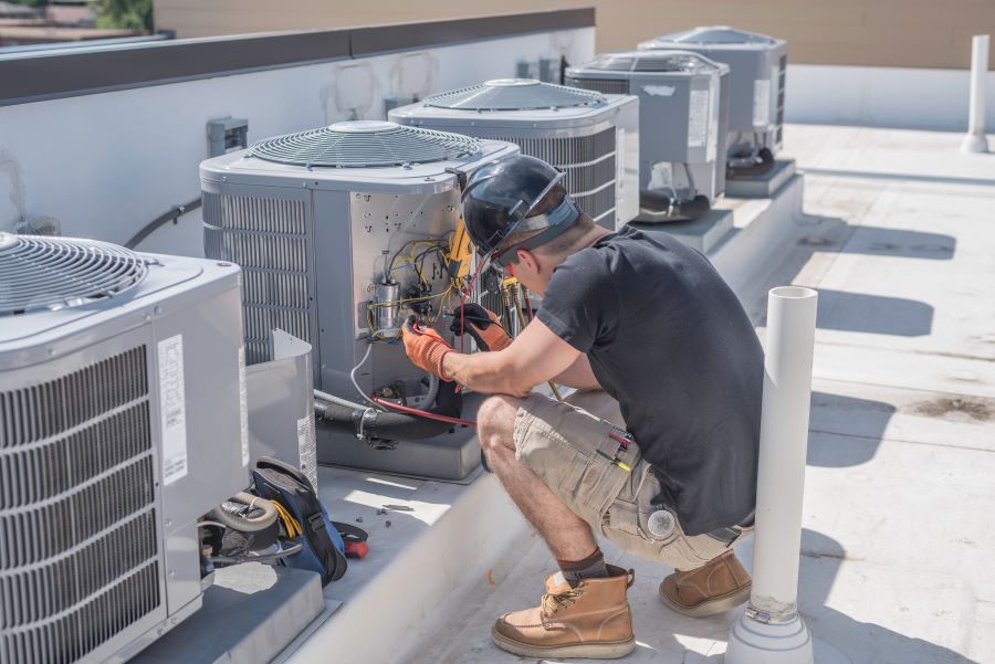 hvac tech checking a unit