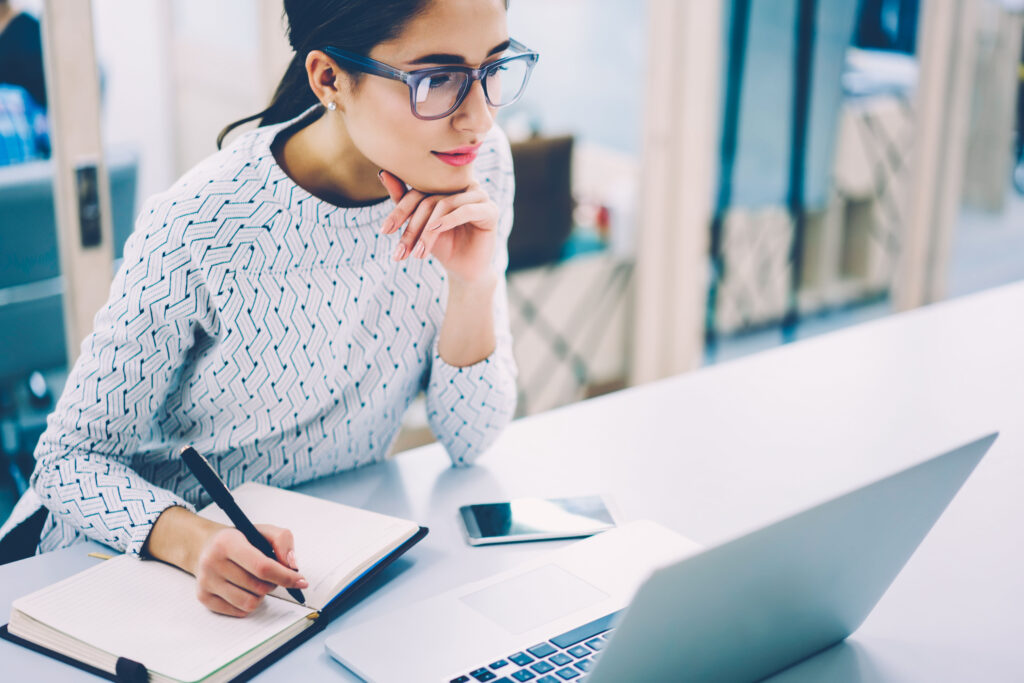 female business owner working using her laptop