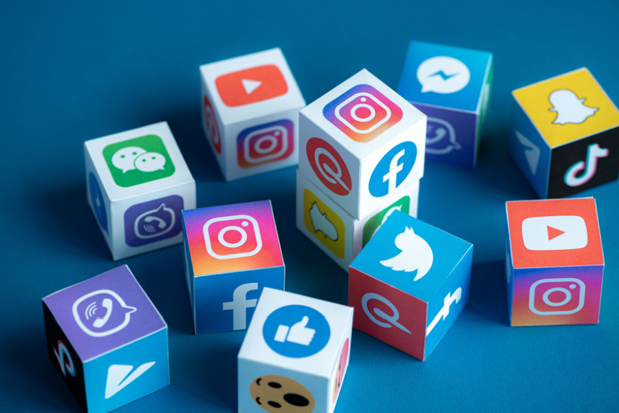 wooden icons of different social media apps