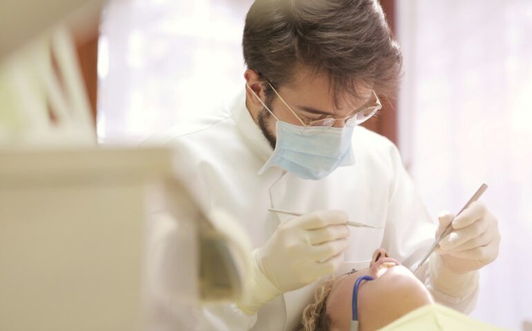 dentist checking child's teeth
