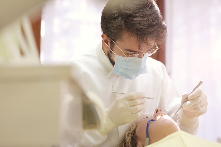 dentist checking child's teeth