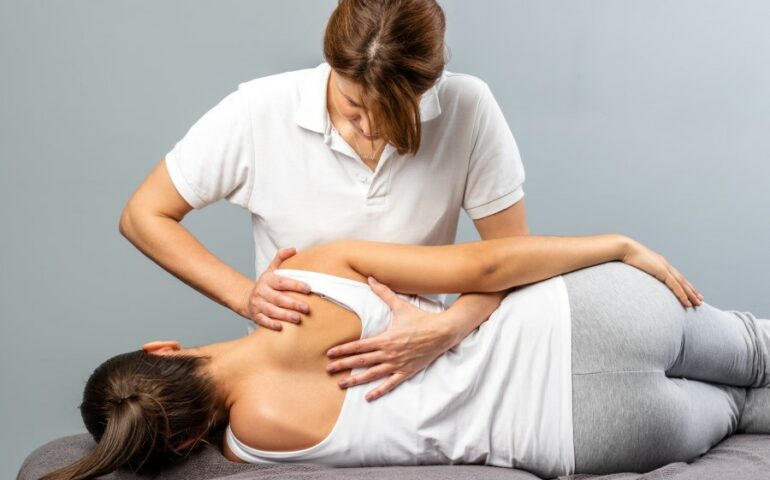 chiropractor with a patient