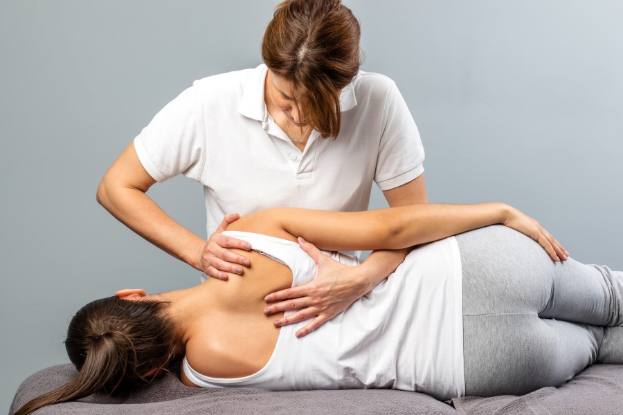 chiropractor with a patient