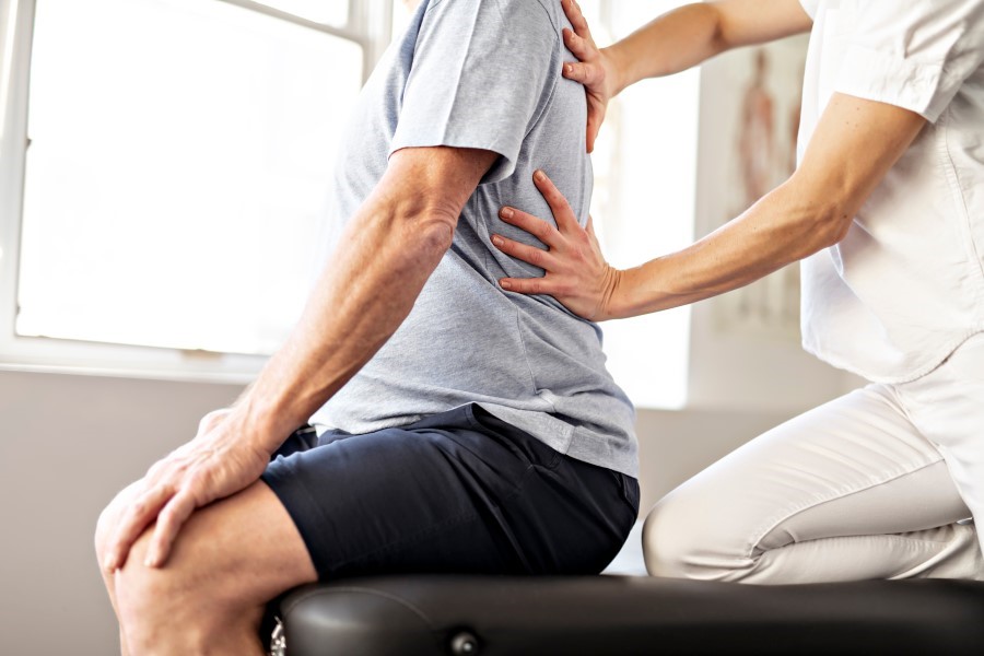 chiropractor with a senior patient